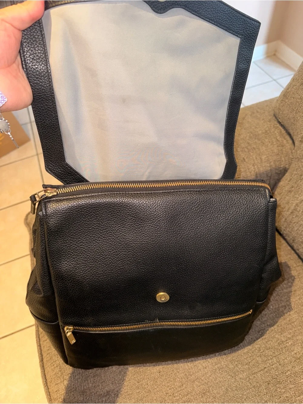 FP Black Leather Fold-Top Backpack with Gold Accents